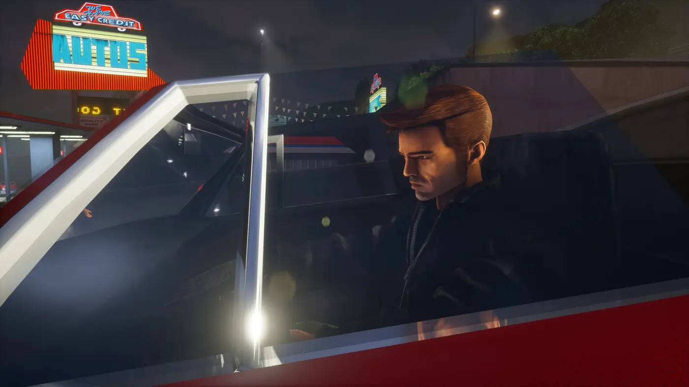 Claude, le protagoniste muet de GTA 3, brun en blouson sombre, au volant d'une voiture la nuit devant un concessionnaire aux néons rouges et bleus de Liberty City