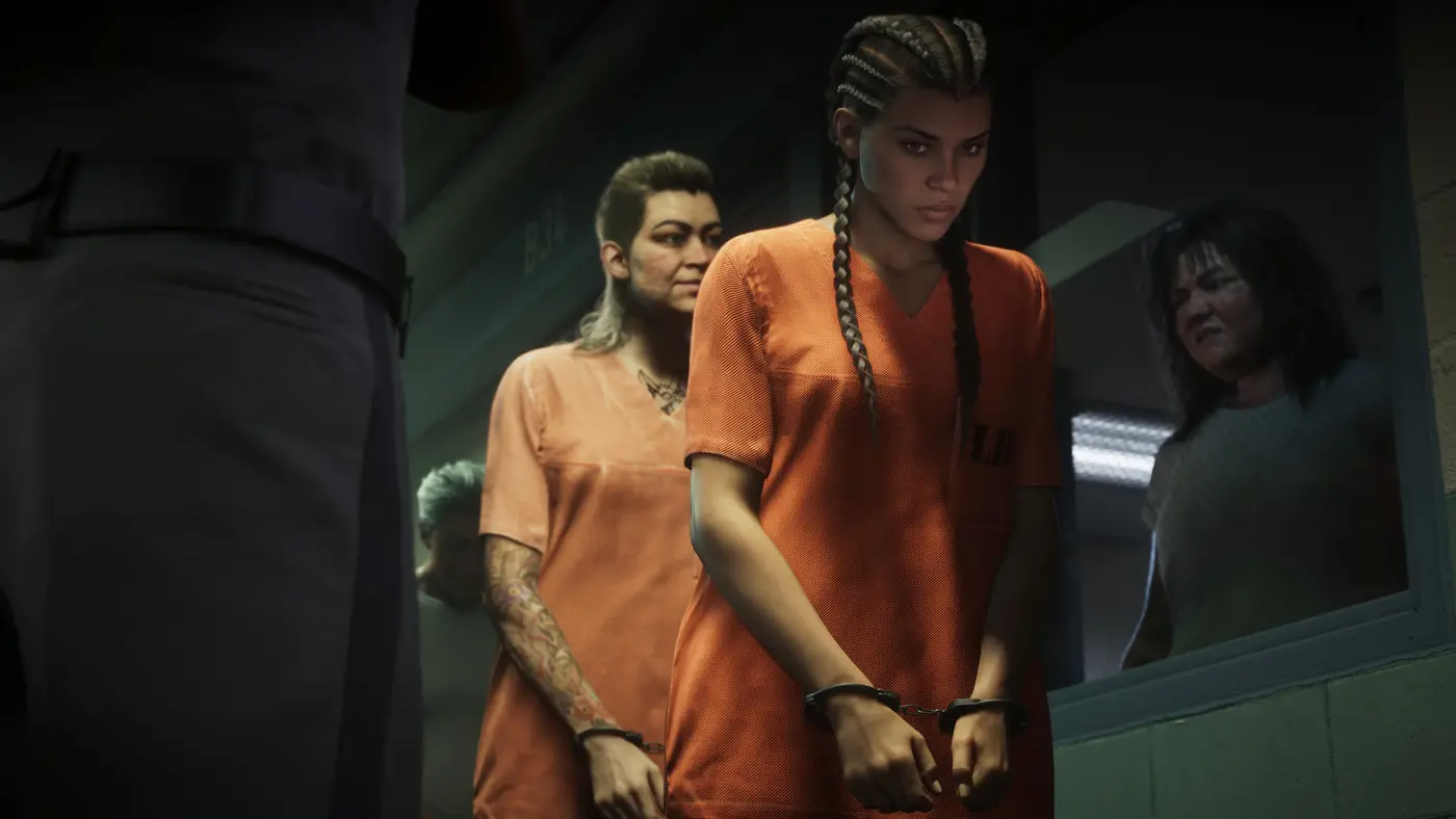 Lucia Caminos menottée, en tenue orange de détenue, escortée dans un couloir de prison de Leonida avec d'autres détenues